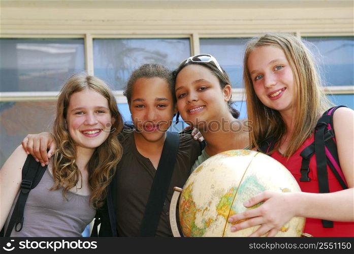 Portrait of a group of young smiling school girls
