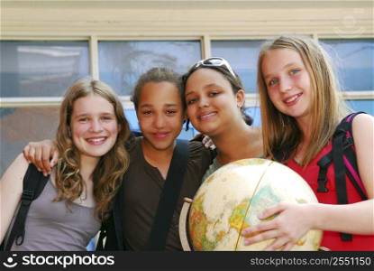 Portrait of a group of young smiling school girls