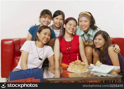 Portrait of a group of young women smiling at a birthday party