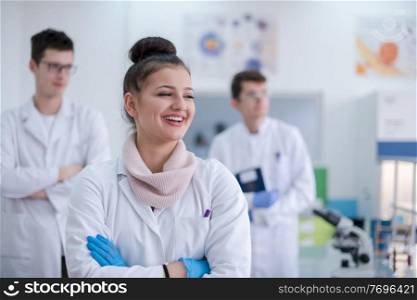portrait of a group young medical students standing together in chemistry laboratory,teamwork by college student indoors