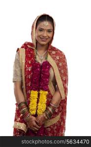 Portrait of a Gujarati bride with a garland