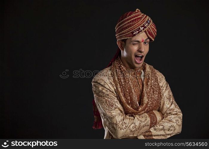 Portrait of a Gujarati groom winking