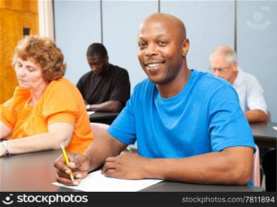 Portrait of a handsome African-american college student in adult education class.