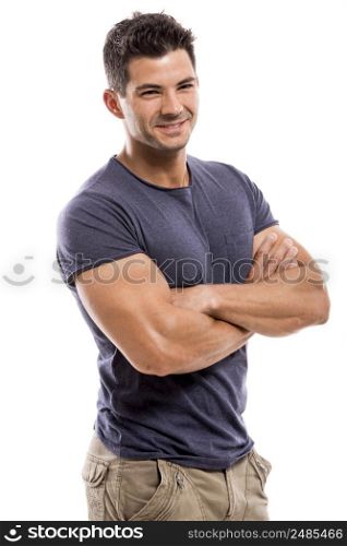 Portrait of a handsome and athletic latin man smiling with hands folded, isolated over a white background