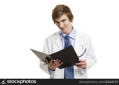 Portrait of a handsome doctor smiling and holding a folder, isolated over a white background