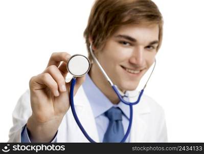 Portrait of a handsome doctor smiling and holding a stethoscope, isolated over a white background