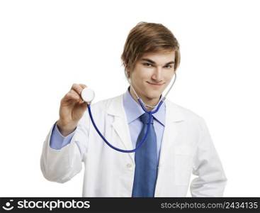 Portrait of a handsome doctor smiling and holding a stethoscope, isolated over a white background