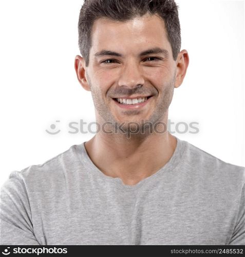 Portrait of a handsome latin man smiling, isolated over a white background