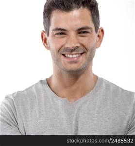 Portrait of a handsome latin man smiling, isolated over a white background