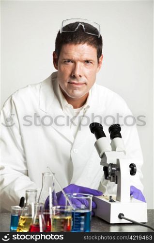 Portrait of a handsome scientist in his laboratory.