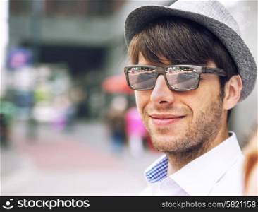 Portrait of a handsome young guy with sunglasses