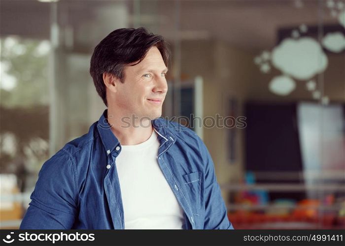 Portrait of a handsome young man in an office