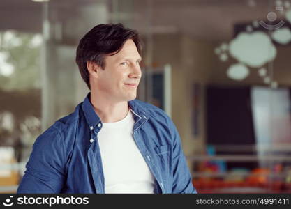 Portrait of a handsome young man in an office