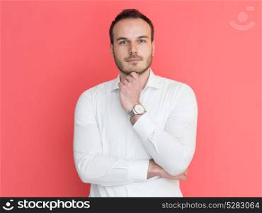 portrait of a handsome young man isolated over a red background