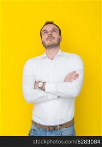 portrait of a handsome young man isolated over a yellow background