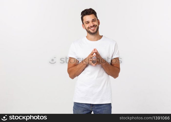 Portrait of a handsome young man smiling against yellow background.. Portrait of a handsome young man smiling against yellow background