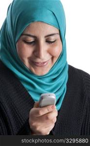 Portrait of a happy Arabic Muslim Woman reading a text message