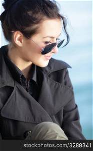 Portrait of a happy beautiful young woman in sunglasses