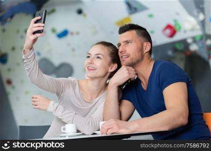 portrait of a happy couple making selfie