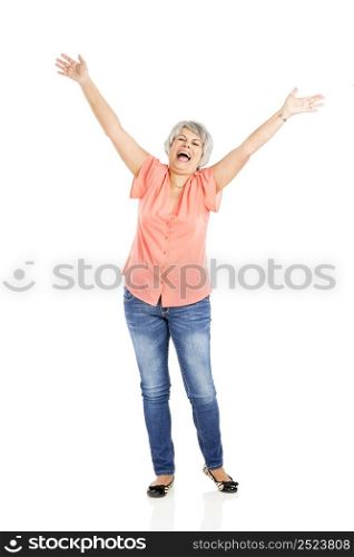 Portrait of a happy elderly woman with arms on the air, isolated on a white background
