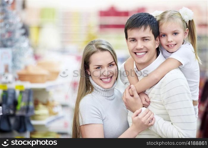 Portrait of a happy family in the store