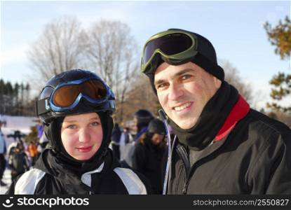 Portrait of a happy family on downhill ski resort