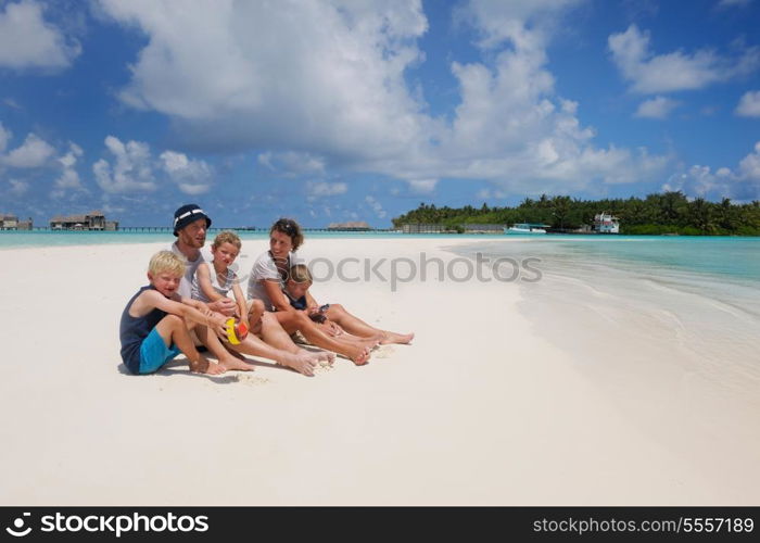 Portrait of a happy family on summer vacation at beach