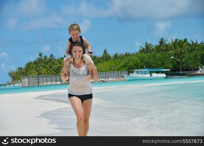 Portrait of a happy family on summer vacation at beach