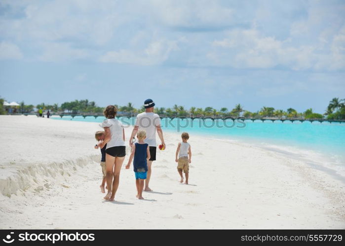 Portrait of a happy family on summer vacation at beach