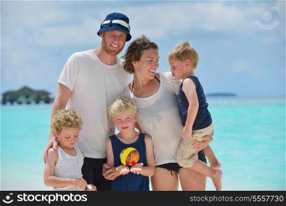Portrait of a happy family on summer vacation at beach