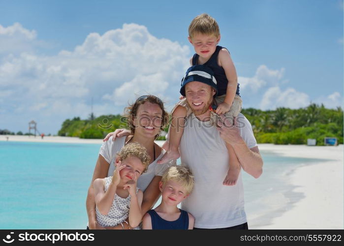 Portrait of a happy family on summer vacation at beach