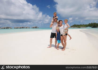 Portrait of a happy family on summer vacation at beach