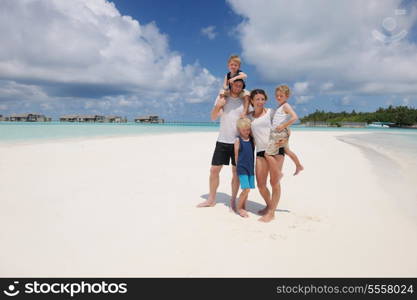 Portrait of a happy family on summer vacation at beach