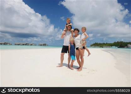 Portrait of a happy family on summer vacation at beach