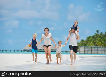 Portrait of a happy family on summer vacation at beach