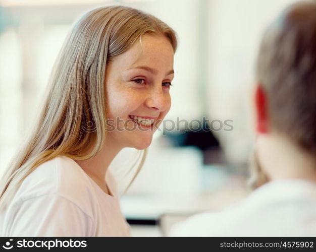 Portrait of a happy girl indoors. Happy young girl smiling