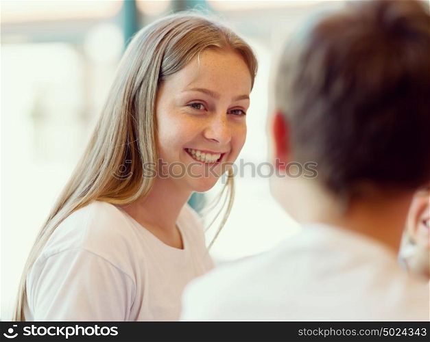 Portrait of a happy girl indoors. Happy young girl smiling