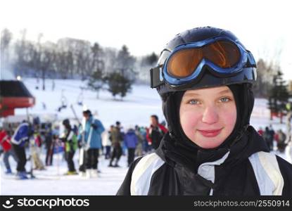 Portrait of a happy girl on downhill ski resort