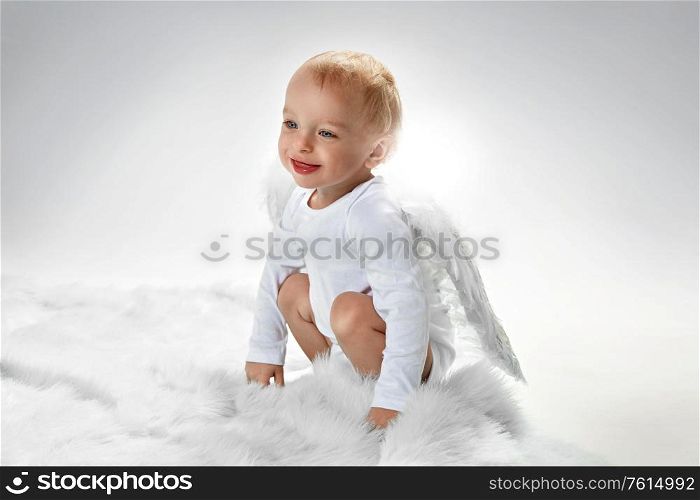 Portrait of a happy little baby angel