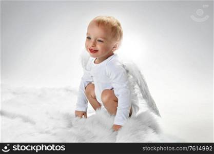 Portrait of a happy little baby angel