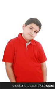 Portrait of a happy little young boy standing with hands in pocket over white background