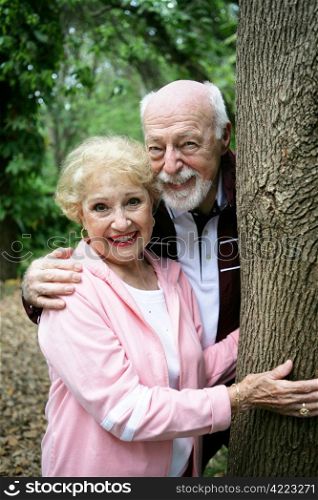 Portrait of a happy loving senior couple together in the park.