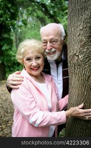 Portrait of a happy loving senior couple together in the park.