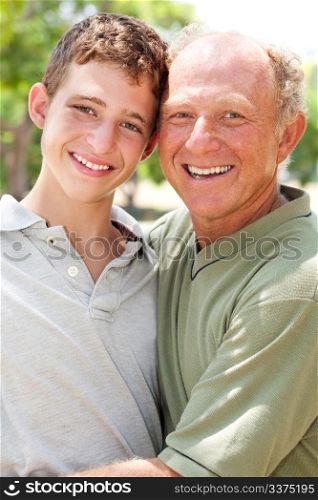 Portrait of a happy old man with adorable grandson