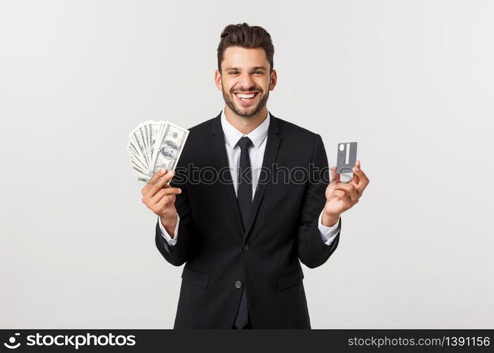 Portrait of a happy smiling man holding bunch of money banknotes and showing credit card isolated over white background. Portrait of a happy smiling man holding bunch of money banknotes and showing credit card isolated over white background.