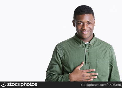 Portrait of a happy young African American man over gray background