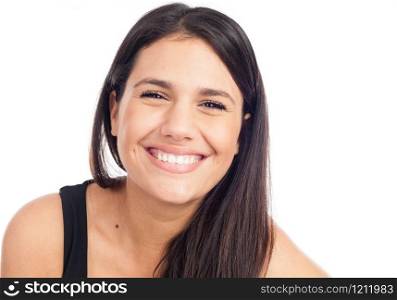 portrait of a happy young brunette woman laughing