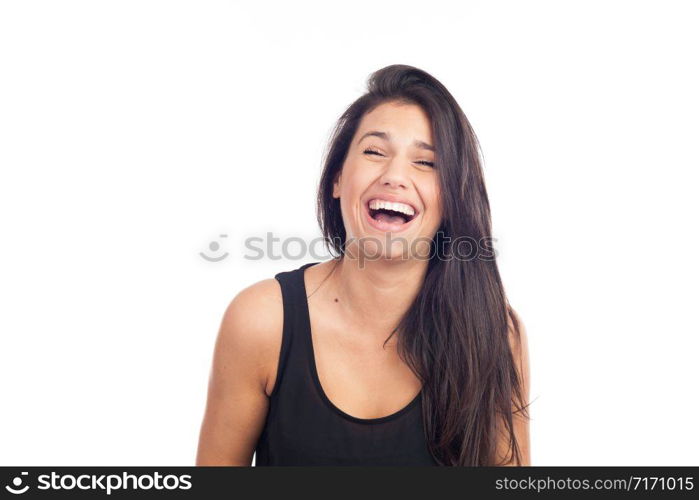 portrait of a happy young brunette woman laughing