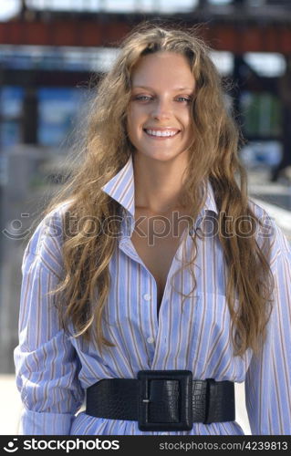 Portrait of a happy young collegian on color background