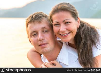 portrait of a happy young couple at the sea